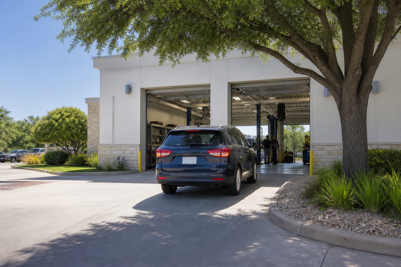 SUV pulling into an open express care service bay